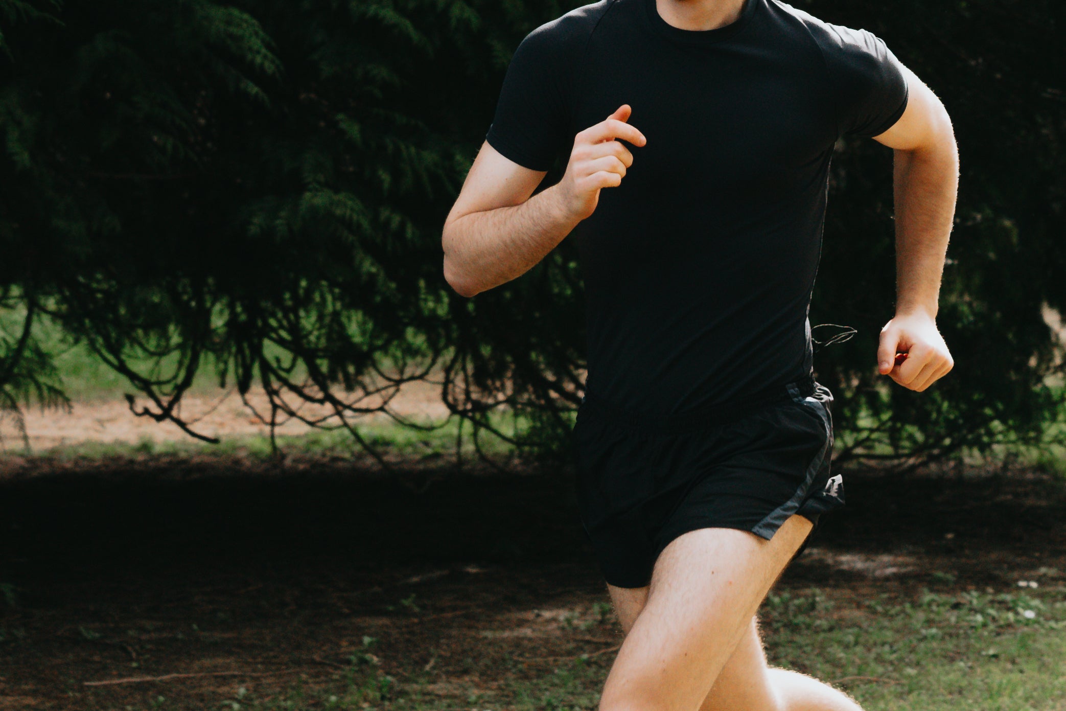 person-in-black-running-in-the-green-outdoors.jpg